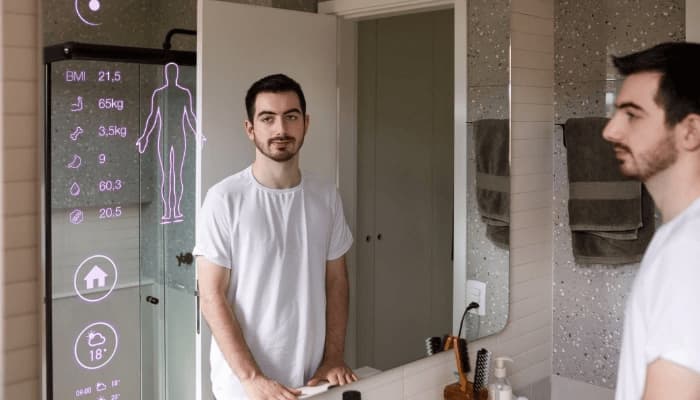 Man monitoring his health stats in his smart mirror