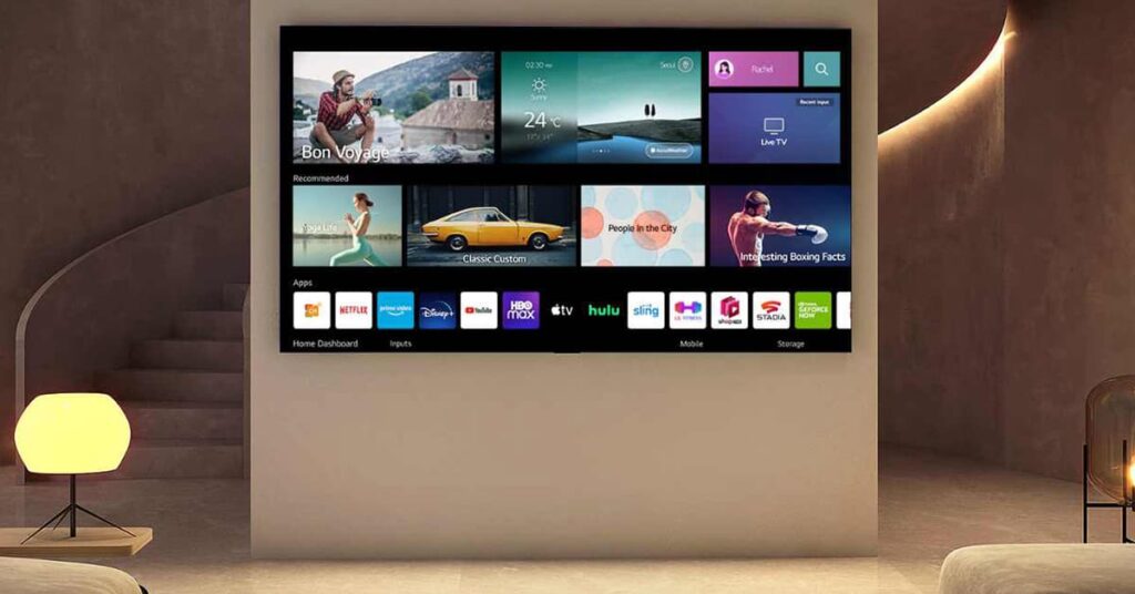 Flat screen Smart TV on the wall with apps on the screen in front of a curved staircase