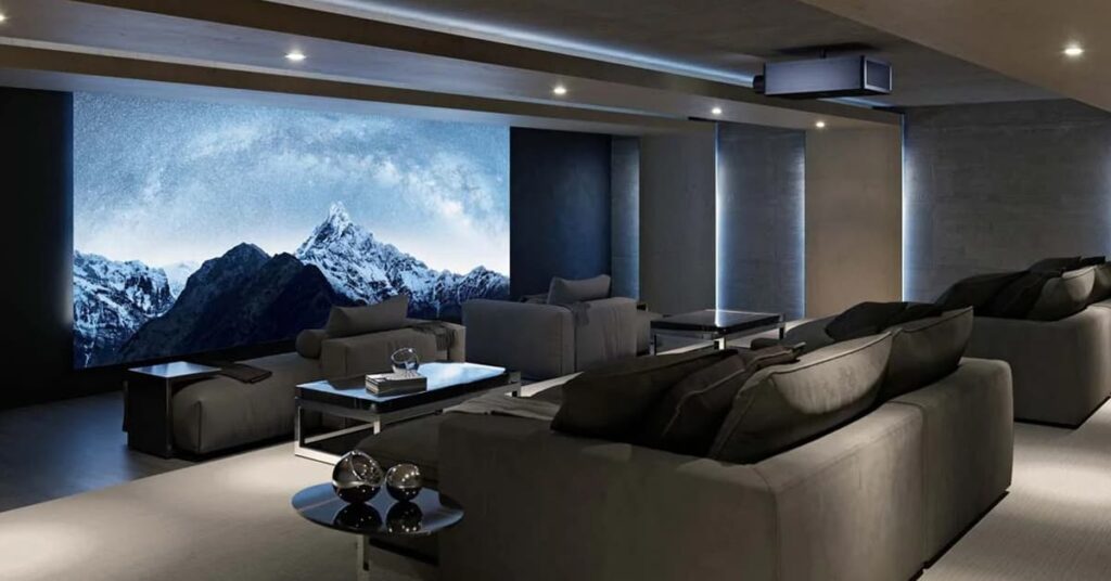 Home theater room with a couch and a large flat screen TV