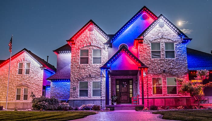 House front showcasing colored red, white, and blue JellyFish lighting