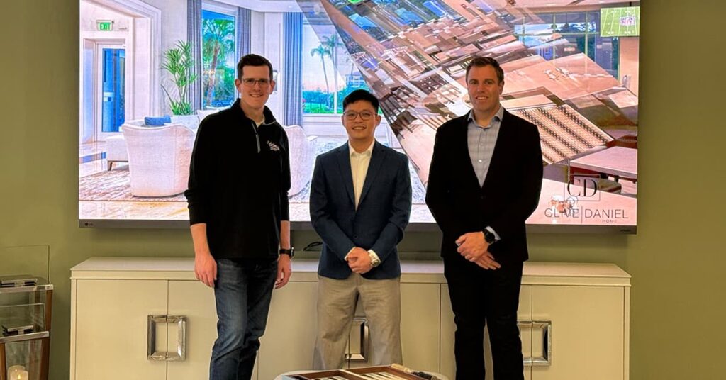Brian Wiersma and Tyler Nary in front of a flat screen TV in the Daisy Naples showroom