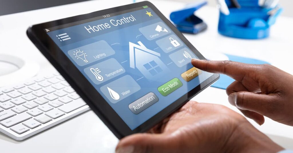 Person using a tablet PC using an app for a home control center on the screen